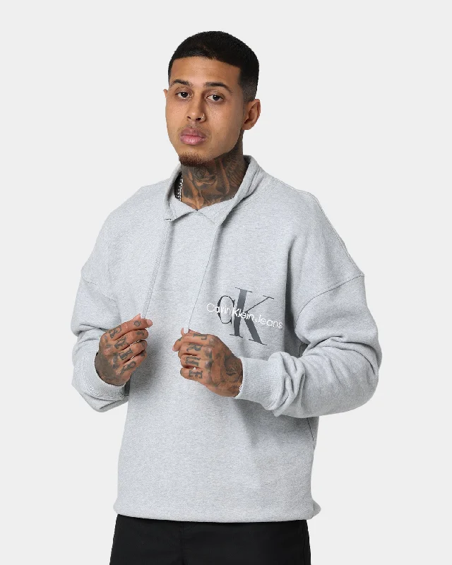 Calvin Klein Monogram Funnel Neck Sweatshirt Light Grey Heat Hoodie with High-Low Hem Asymmetrical Trendy Calvin Klein Monogram Funnel Neck Sweatshirt Light Grey Heat Hoodie with High-Low Hem Asymmetrical Trendy