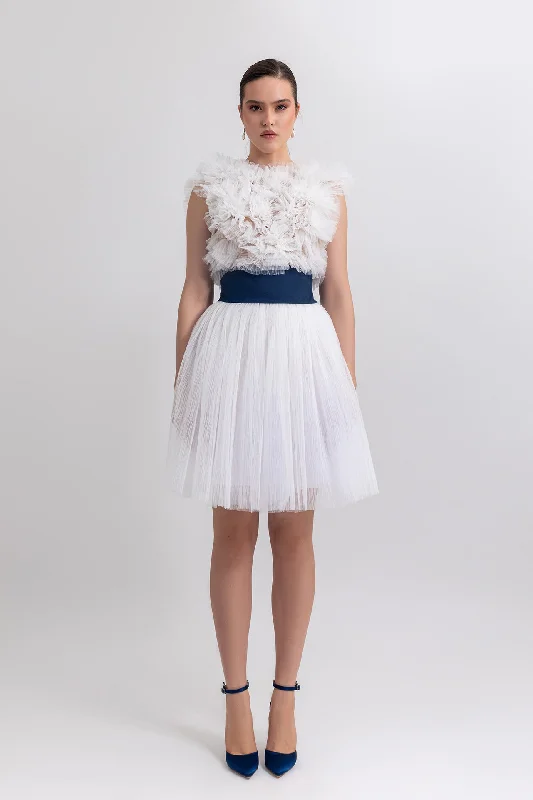 Ruffled top with short tulle skirt leather skirt refined